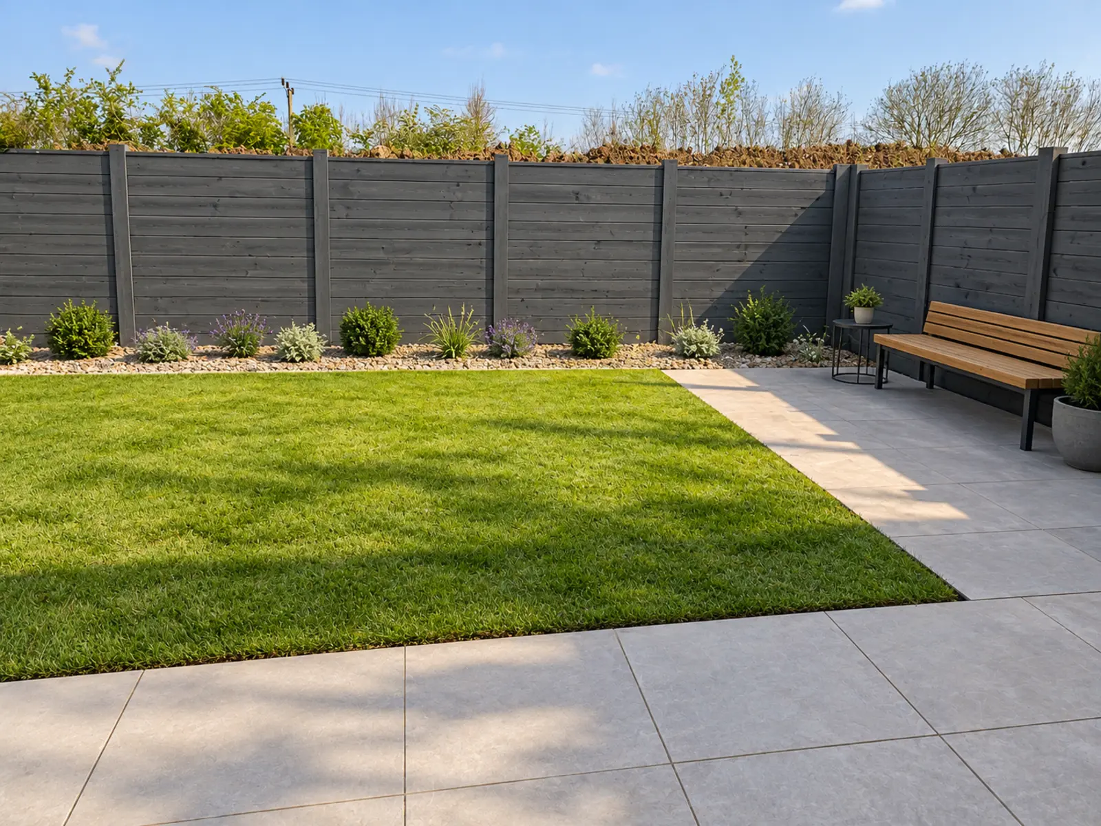 Modern garden concept with clean lines, structured planting and a neat lawn